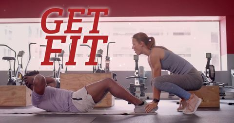 Motivational workout session with fitness coaches in gym