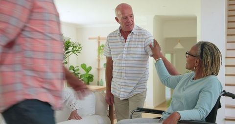 Senior Friends Embracing Fellowship and Joyful Moments at Home