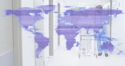 Senior walking with caregiver using walker in hospital corridor with digital world map