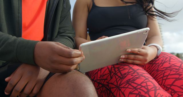 Friends Reviewing Content on Tablet During Outdoor Workout - Download Free Stock Images Pikwizard.com