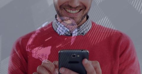 Smiling Man Holding Smartphone with Digital World Map Overlay