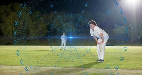 Leaning cricketer watching night match with digital hud overlay on floodlit grass field