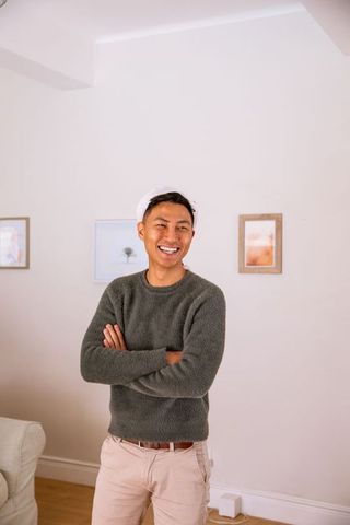 Smiling Man Enjoying Cozy Living Room Interior