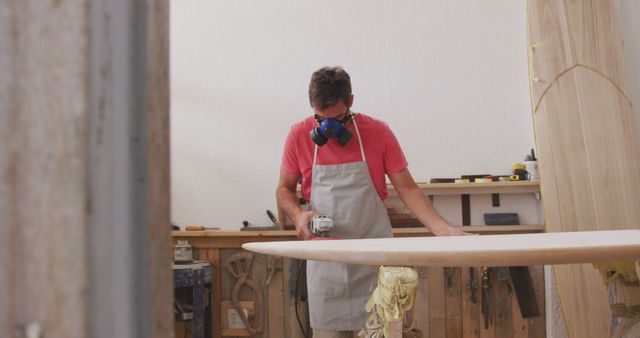 Man Shaping Surfboard in Workshop, Crafting with Precision - Download Free Stock Images Pikwizard.com