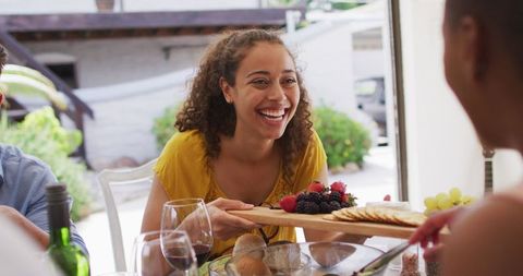 Cheerful Gathering Enjoying Appetizers at Backyard Dinner Party