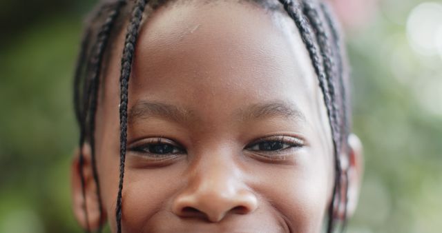 Close-Up of Young Child Smiling Outdoors on a Sunny Day - Download Free Stock Images Pikwizard.com