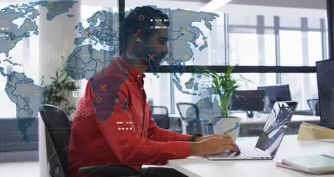 Analyst Using Laptop with Global Data Visualization Interface