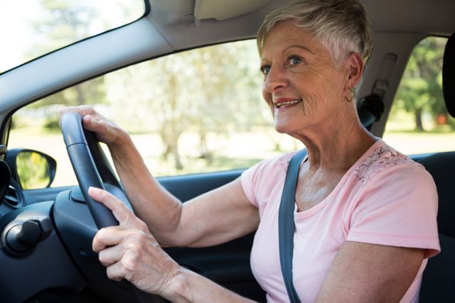 Senior woman driving a car - Download Free Stock Photos Pikwizard.com