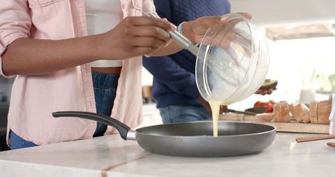 Couple Preparing Batter in Modern Kitchen Setting