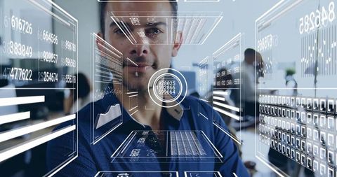 Man analyzing holographic data in futuristic office environment