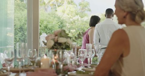 Elegant Wedding Reception with Floral Centerpiece and Fine Dining