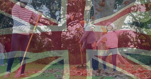 Family enjoying autumn day in park with union jack overlay