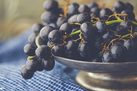 Black Grapes in Metal Bowl on Blue Checked Cloth