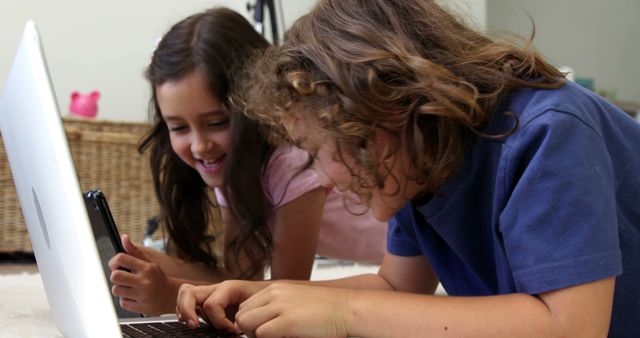 Happy Children Learning with Laptop and Smartphone at Home - Download Free Stock Images Pikwizard.com