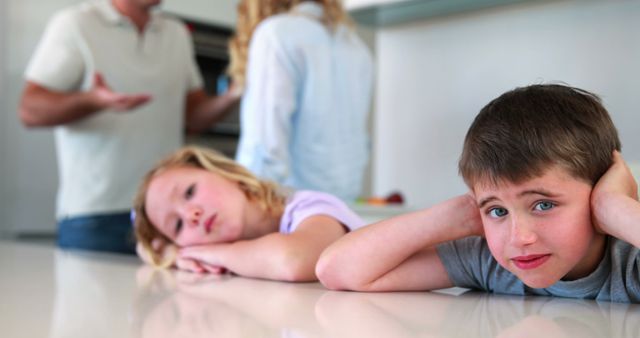 Upset Children Ignoring Parents' Argument in Modern Kitchen - Download Free Stock Images Pikwizard.com