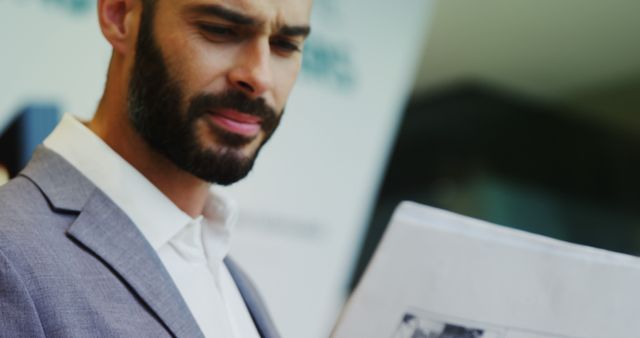 Confident Businessman Reading Newspaper Outdoors - Download Free Stock Images Pikwizard.com