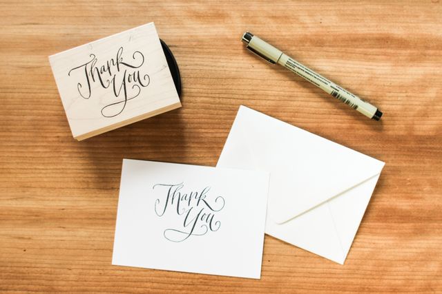 Handwritten Thank You Note and Envelope on Wooden Desk - Download Free Stock Photos Pikwizard.com