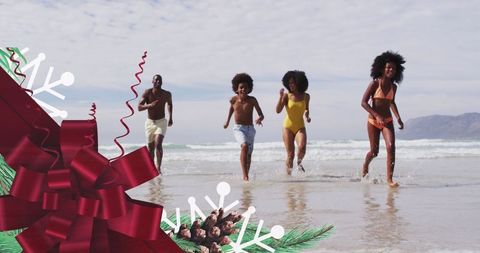 Joyful Family Running on Beach with Holiday Theme Enhancements