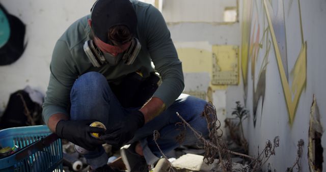 Restorer Wearing Gloves and Mask, Working on Damaged Building - Download Free Stock Images Pikwizard.com