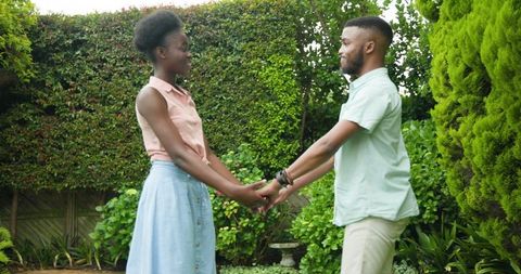 Young couple sharing romantic moment in garden