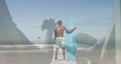 Surfer standing on beach holding light blue surfboard facing ocean with translucent overlay