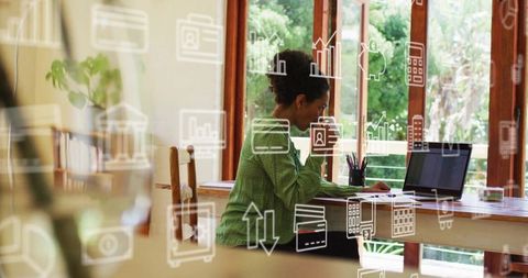 Businesswoman Analyzing Data with Digital Icons Surrounding