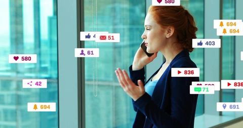 Redhead executive talking on phone, gesturing with social media notification overlays