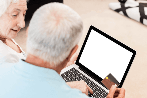 Senior Couple Online Shopping with Laptop Transparent Black Screen