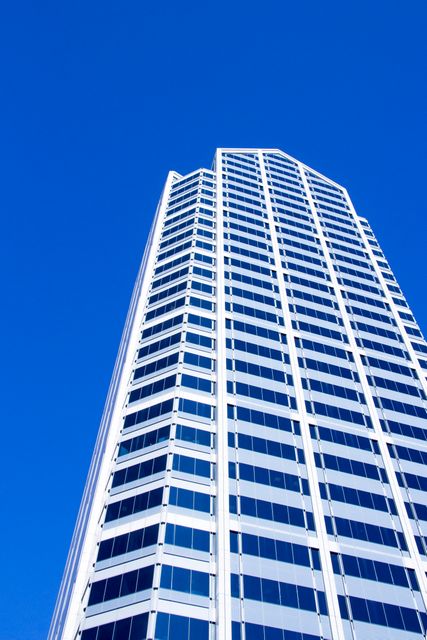 Modern Skyscraper Against Clear Blue Sky - Download Free Stock Photos Pikwizard.com