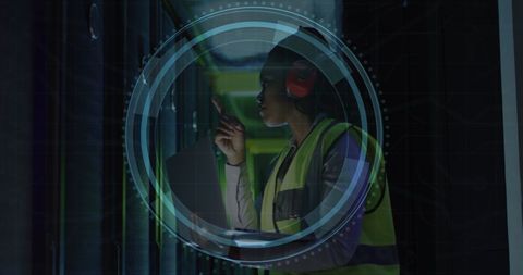 Cybersecurity Engineer Analyzing Data in Server Room