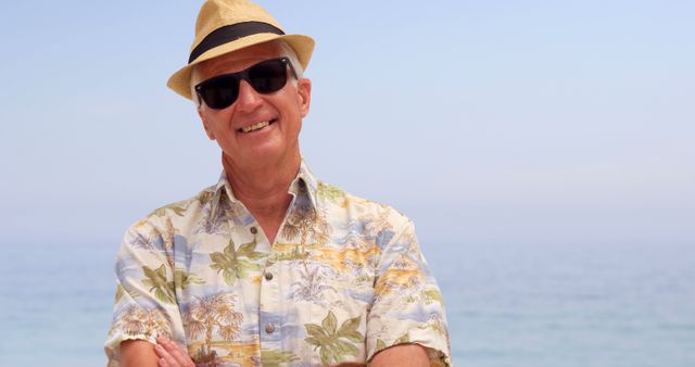 Senior Man Enjoying Beach Vacation in Tropical Shirt - Download Free Stock Images Pikwizard.com