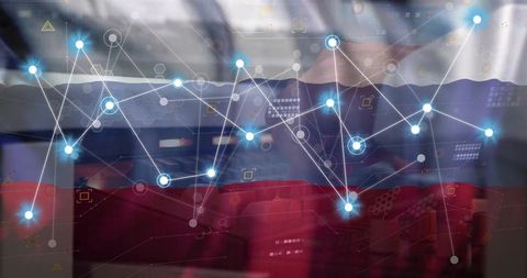Businessman typing on laptop with futuristic network visualization and analytics overlay