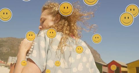 Happy Couple Embracing at Sunny Beach with Joyful Emojis