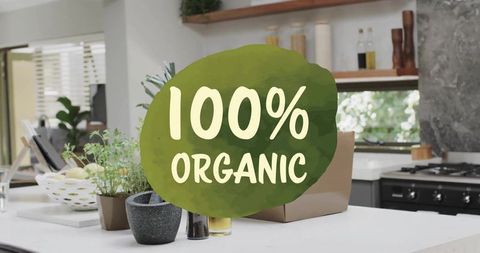 Displaying 100% organic label on modern kitchen island with fresh herb pots
