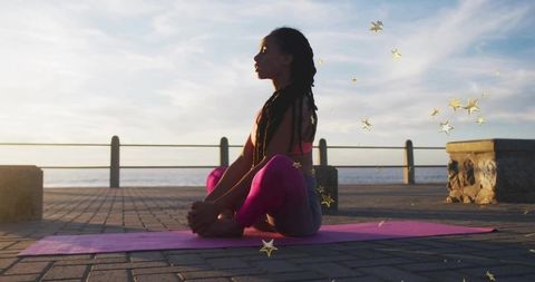 Outdoor Yoga Meditation at Seaside Promenade during Sunset