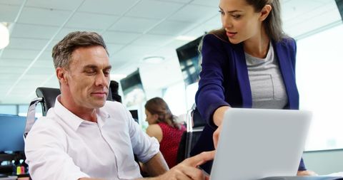 Professionals Collaborating with Laptop in Modern Office - Download Free Stock Images Pikwizard.com