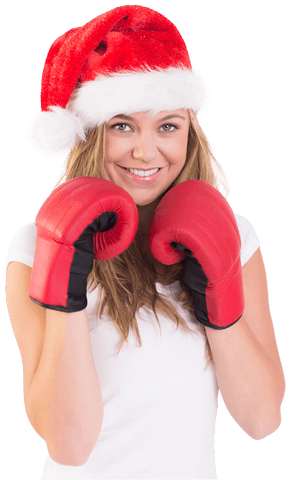 Festive Blonde Woman in Boxing Gloves Wearing Transparent Santa Hat - Download Free Stock Videos Pikwizard.com