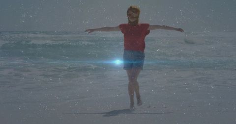 Woman enjoying sunny beach with glitter effect