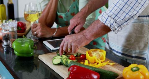 Couple Preparing Fresh Vegetables Together in Cozy Home Kitchen - Download Free Stock Images Pikwizard.com