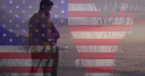 Romantic biracial couple at beach with usa flag overlay