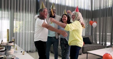 Colleagues celebrating with confetti at office gathering