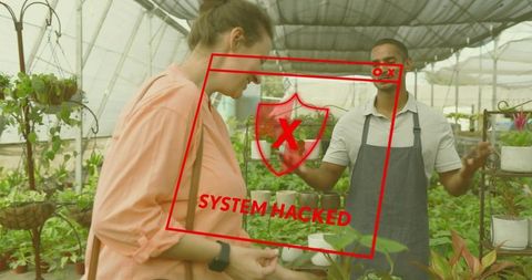 Vendor guiding shopper holding small potted plant inside sunlit greenhouse nursery