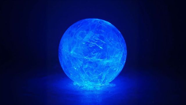 Glowing blue crystal sphere with futuristic textures
