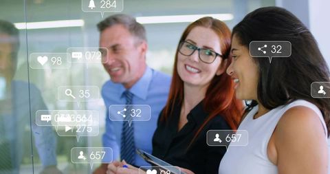 Professional Team Analyzing Social Media Insights in Modern Office