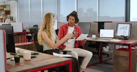 Colleagues Brainstorming Project Ideas in Modern Office with Technology