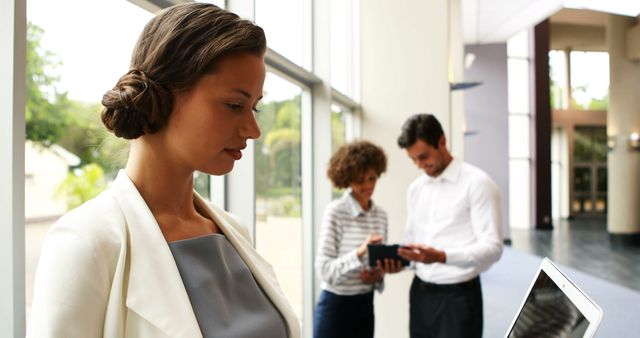 Focused businesswoman working on a digital tablet in an office - Download Free Stock Images Pikwizard.com