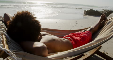 Relaxing in Hammock by Sunny Seaside