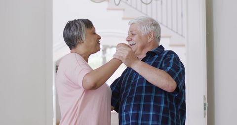 Happy Senior Couple Dancing Joyfully at Home - Download Free Stock Images Pikwizard.com