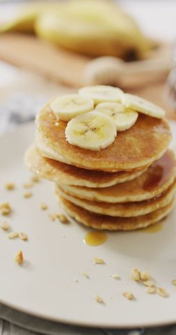 Delicious Pancakes Stack Topped with Sliced Bananas