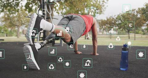 Adaptive athlete holding plank with running prosthetic leg outdoors training strength